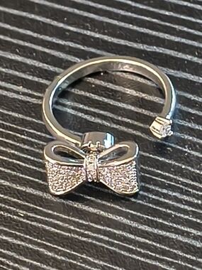 Silver Tone Bow Spinner Ring Adjustable Fidget Ring Cubic Zirconia Accent
